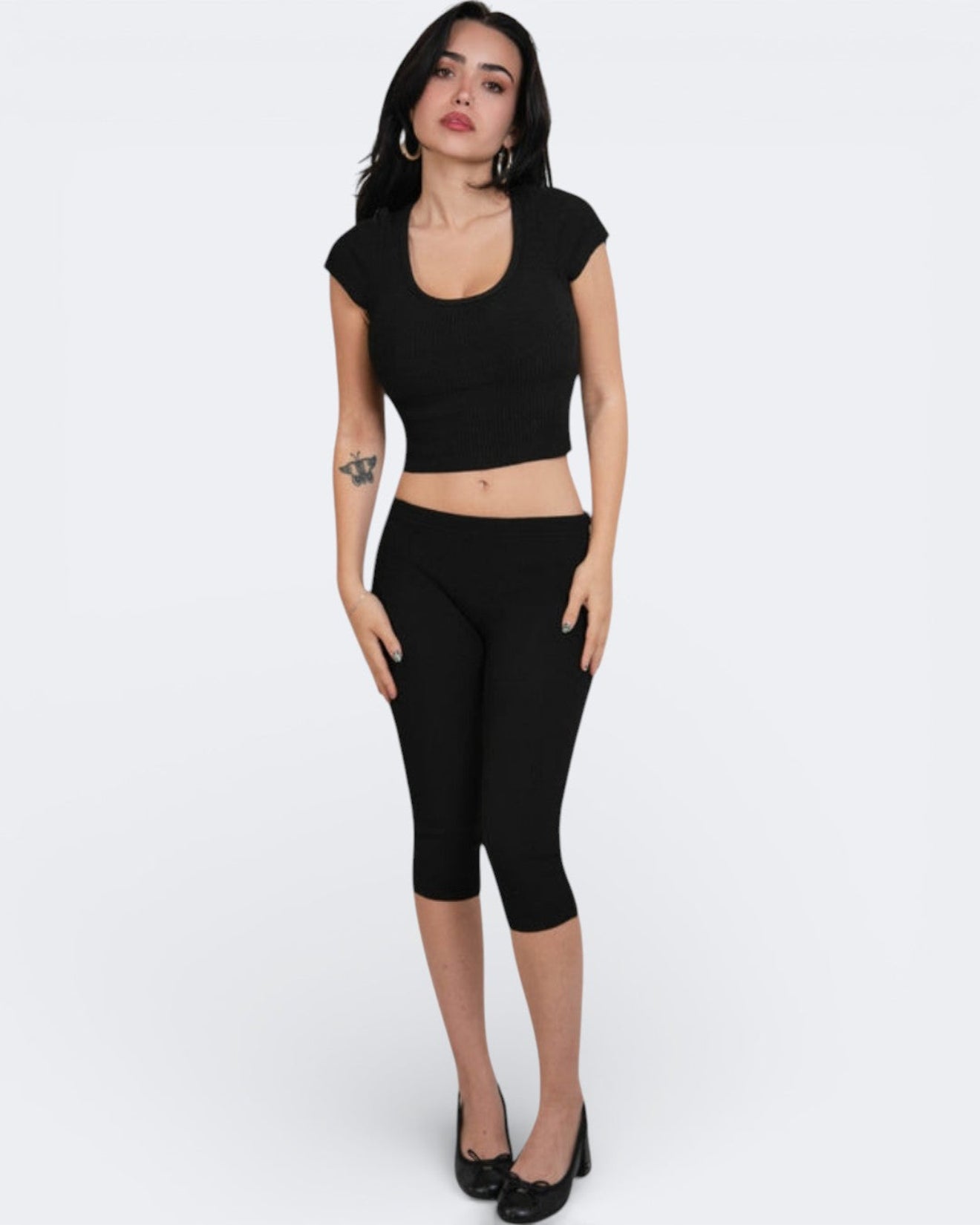 woman wearing fitted rib knit capri with matching scoop neck top in Ink black by The Knit House LA.
