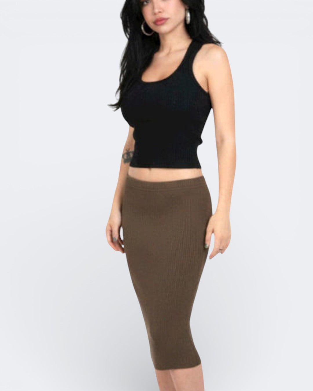Woman wearing a rib knit Ink black tank top with scoop neckline and brown pencil midi skirt by The Knit House LA on a white background