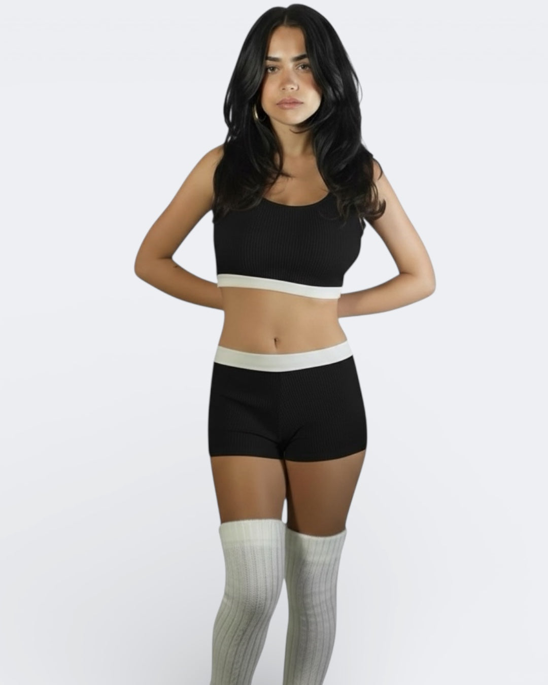 woman wearing fitted rib knit crop tank with scoop neckline and matching boy short in Ink black by The Knit House LA.