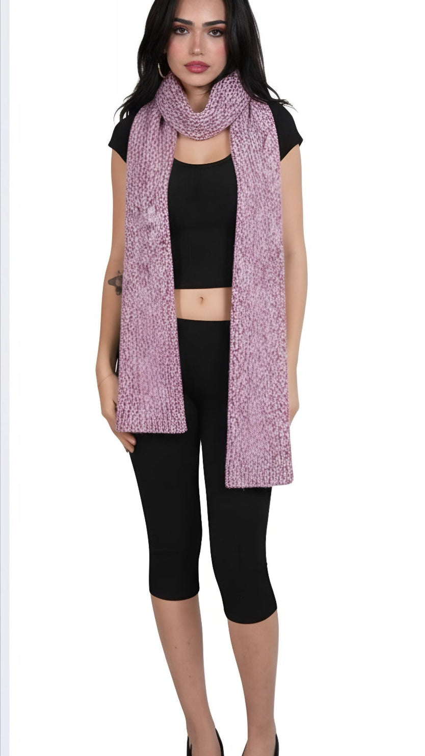 Woman wearing a pink orchid bone knit scarf by The knit House LA with a white background