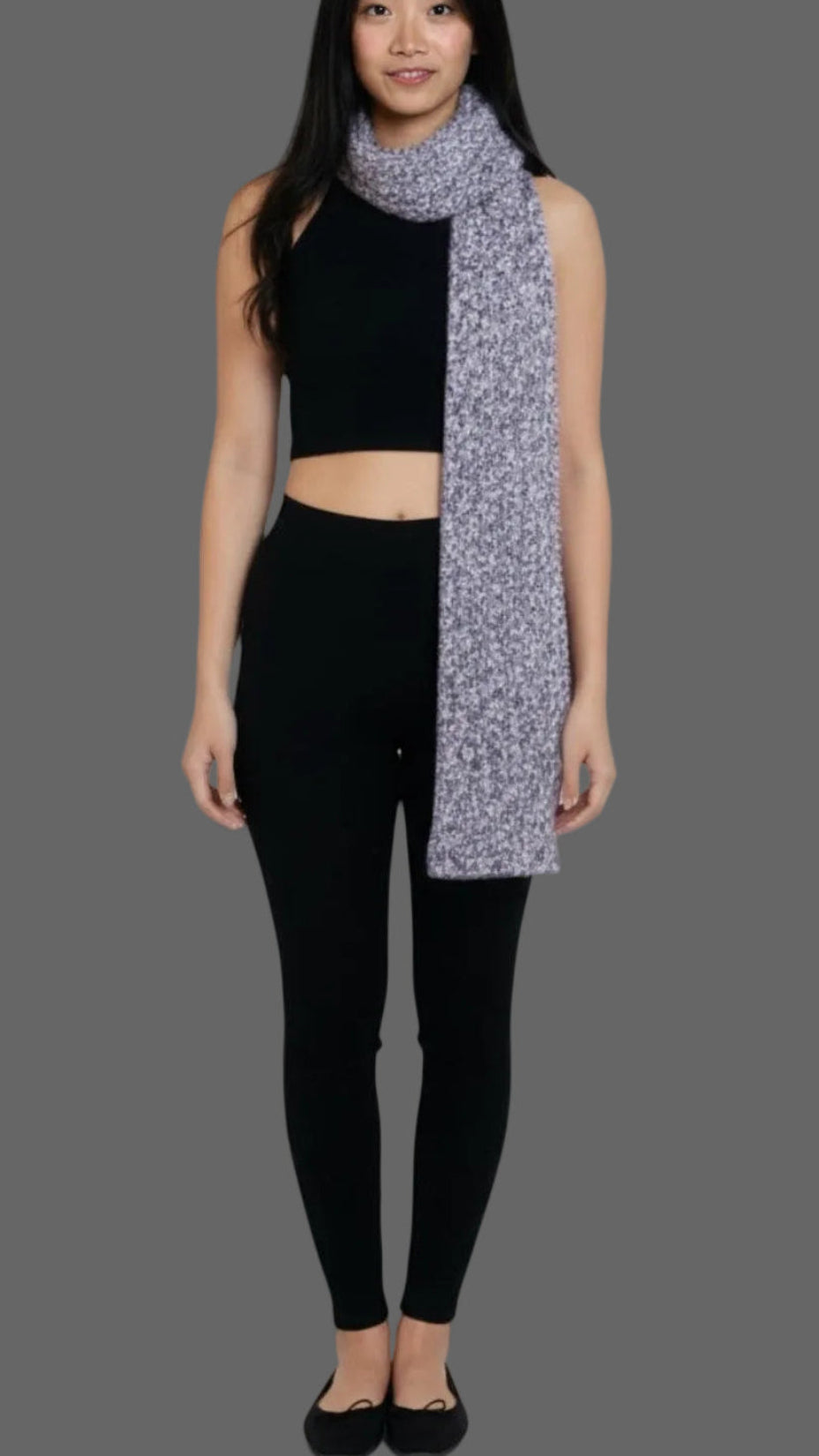 woman wearing an Ink black set  with a textured knit scarf in purple Violet and bone mixed yarns by The Knit House LA.