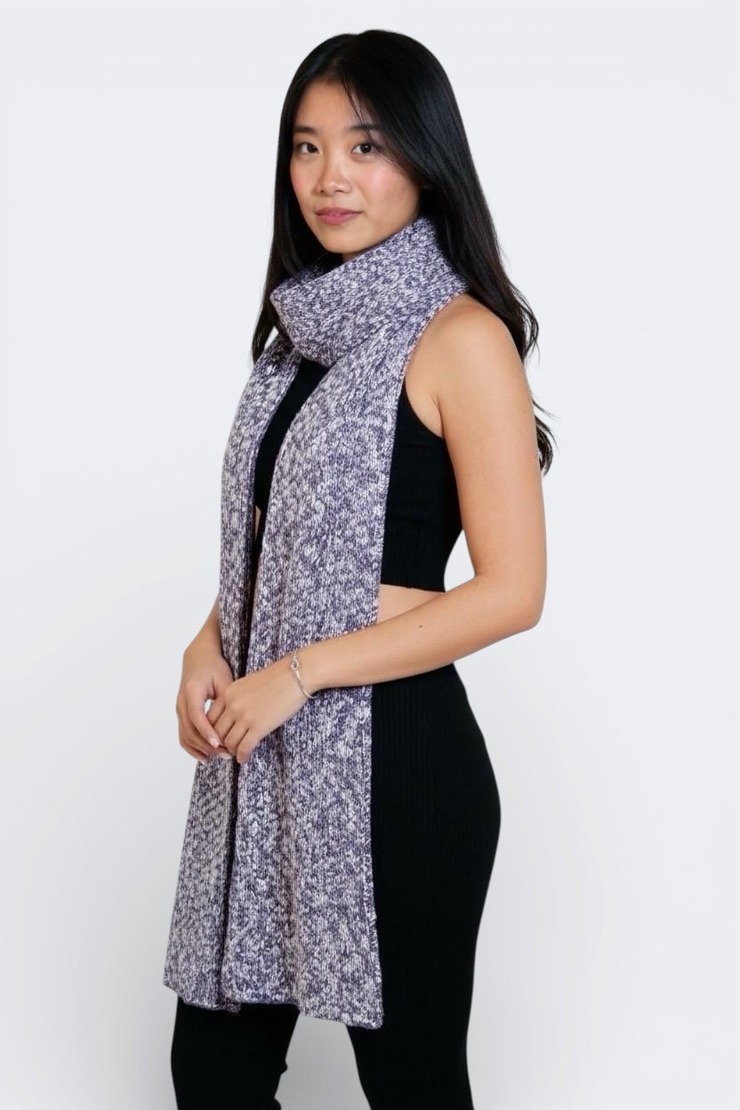 woman wearing an Ink black set  with a textured knit scarf in purple Violet and bone mixed yarns by The Knit House LA.