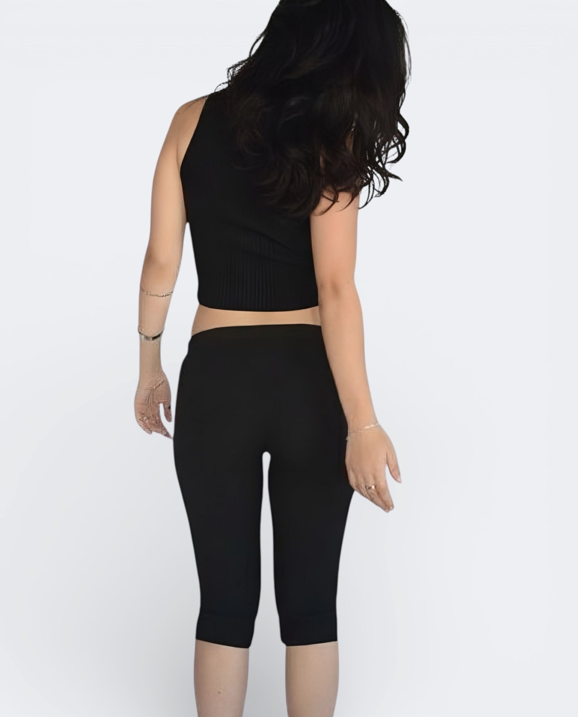 Back view of fitted rib knit capri with side slit detail in Ink Black by The Knit House LA.