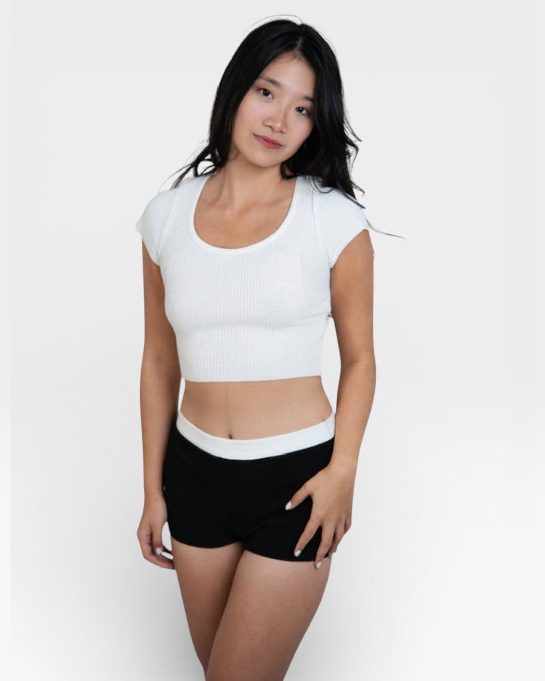 Woman wearing rib knit boy short in Ink black by The Knit House LA.