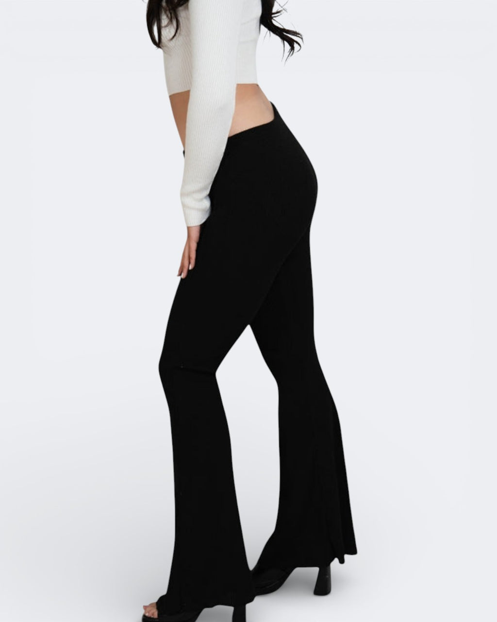 Side view of fitted rib knit flared leg pant and top in Ink black by The Knit House LA