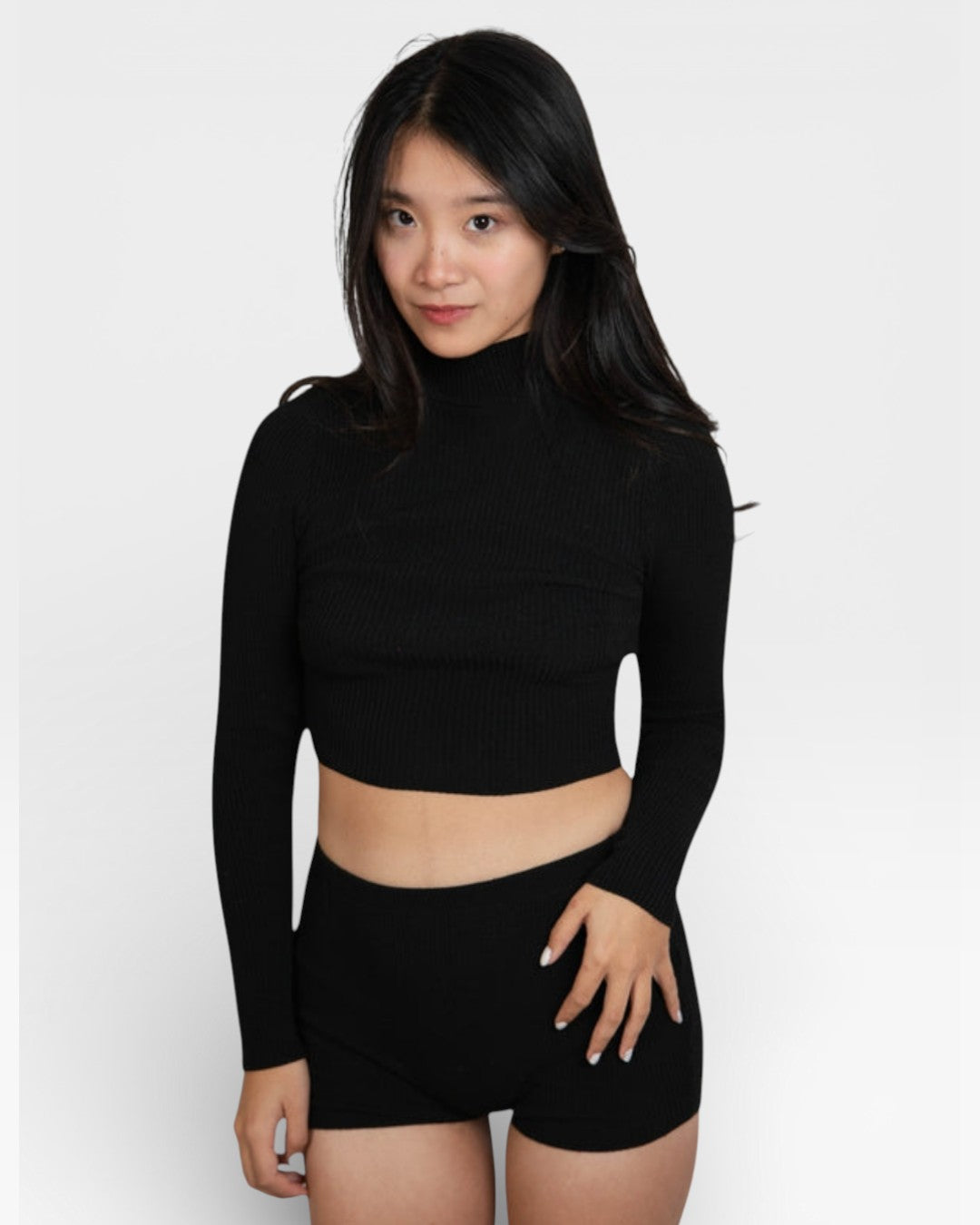 woman wearing fitted rib knit hot pant shorts in Ink black by The Knit House La