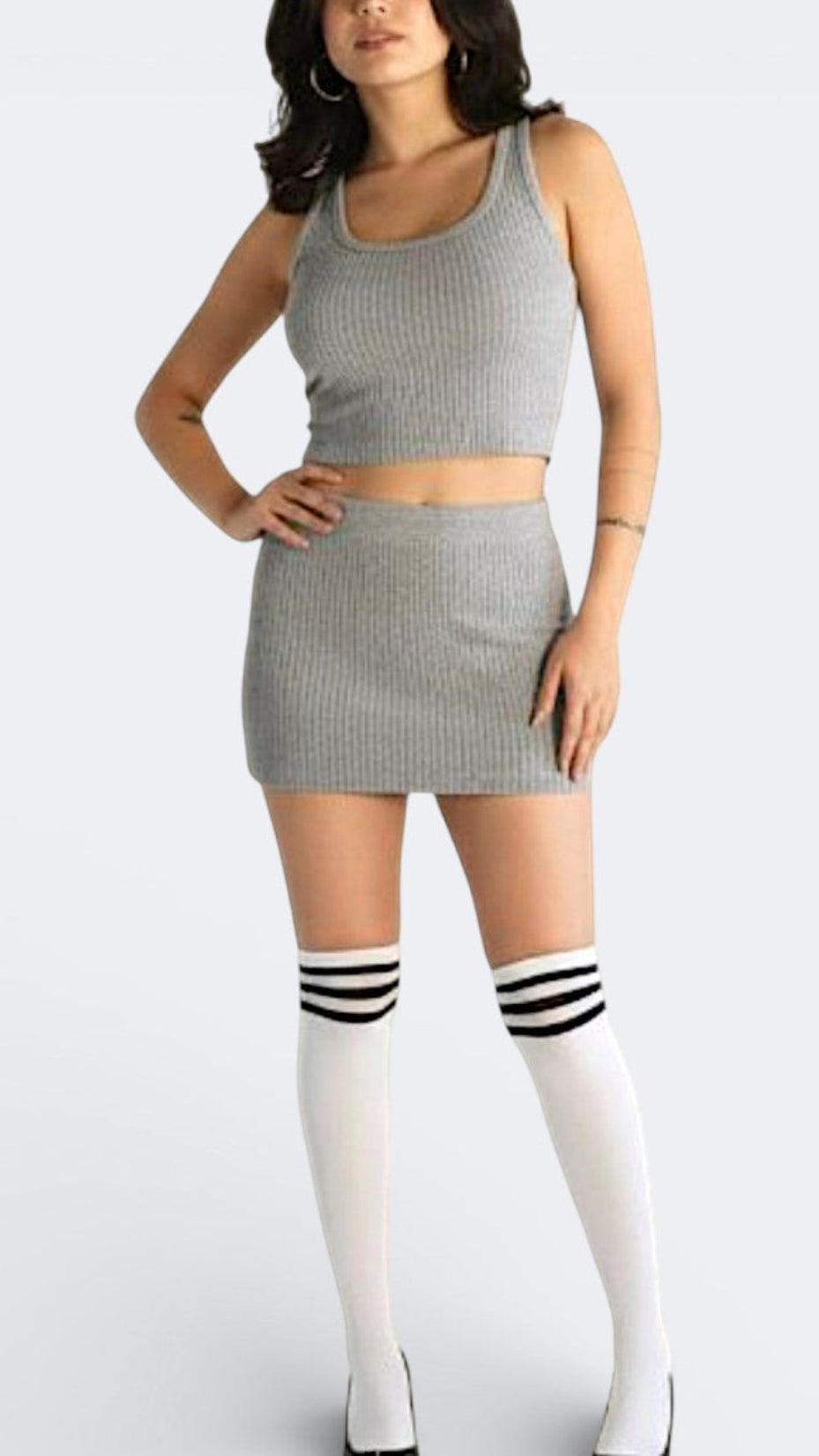 Woman wearing a crop ribbed tank top and rib knit micro mini in Mist grey by The Knit House LA.