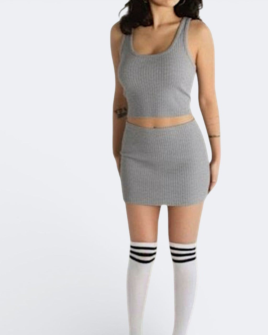 woman wearing a fitted grey rib knit micro mini and crop top in Mist grey by The Knit House LA.