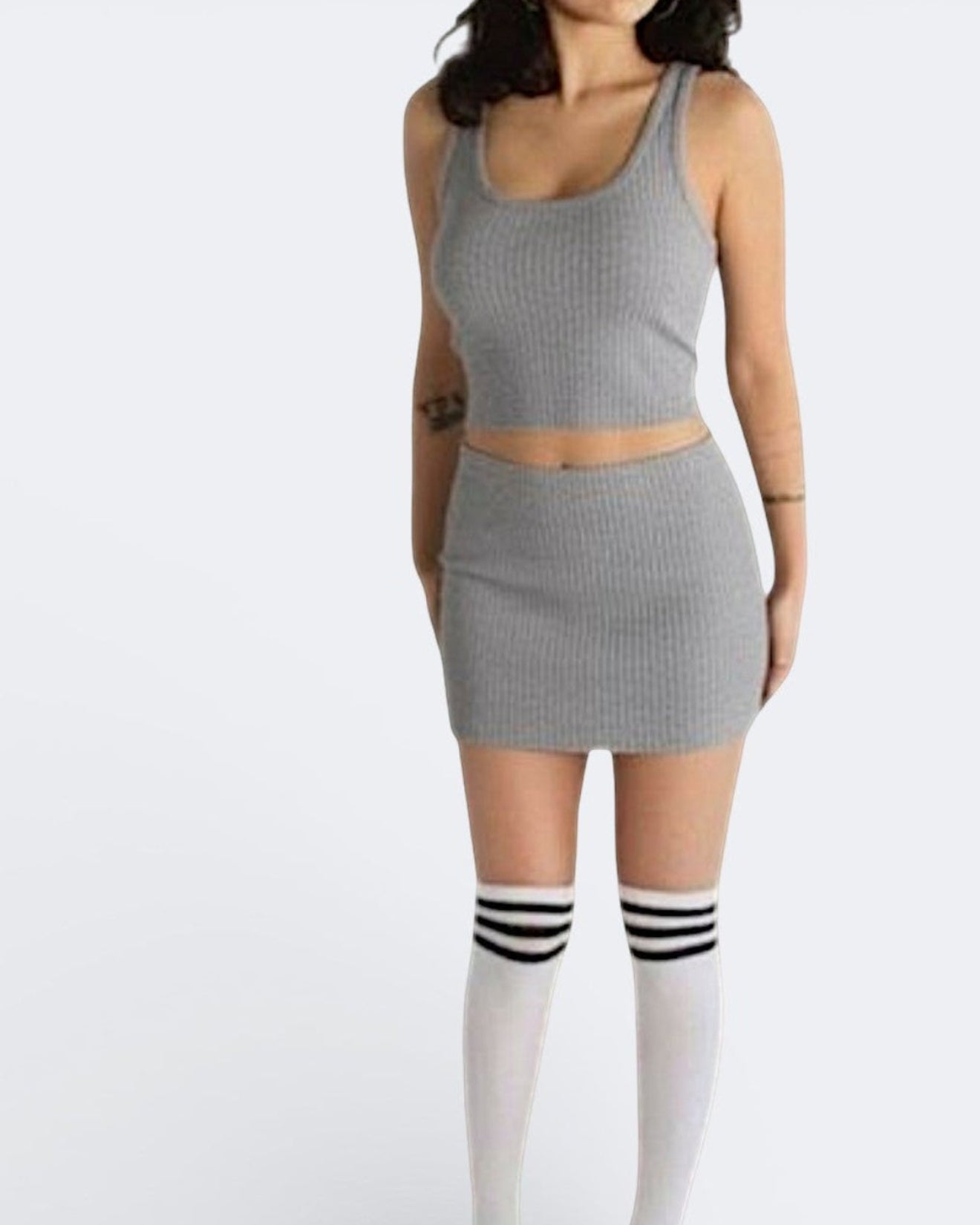 woman wearing a fitted grey rib knit micro mini and crop top in Mist grey by The Knit House LA.