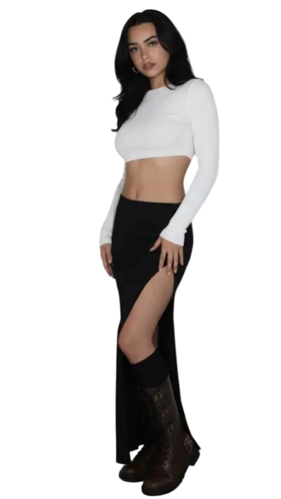 Woman wearing a white long-sleeve top and black high-waisted skirt with a slit on a white background