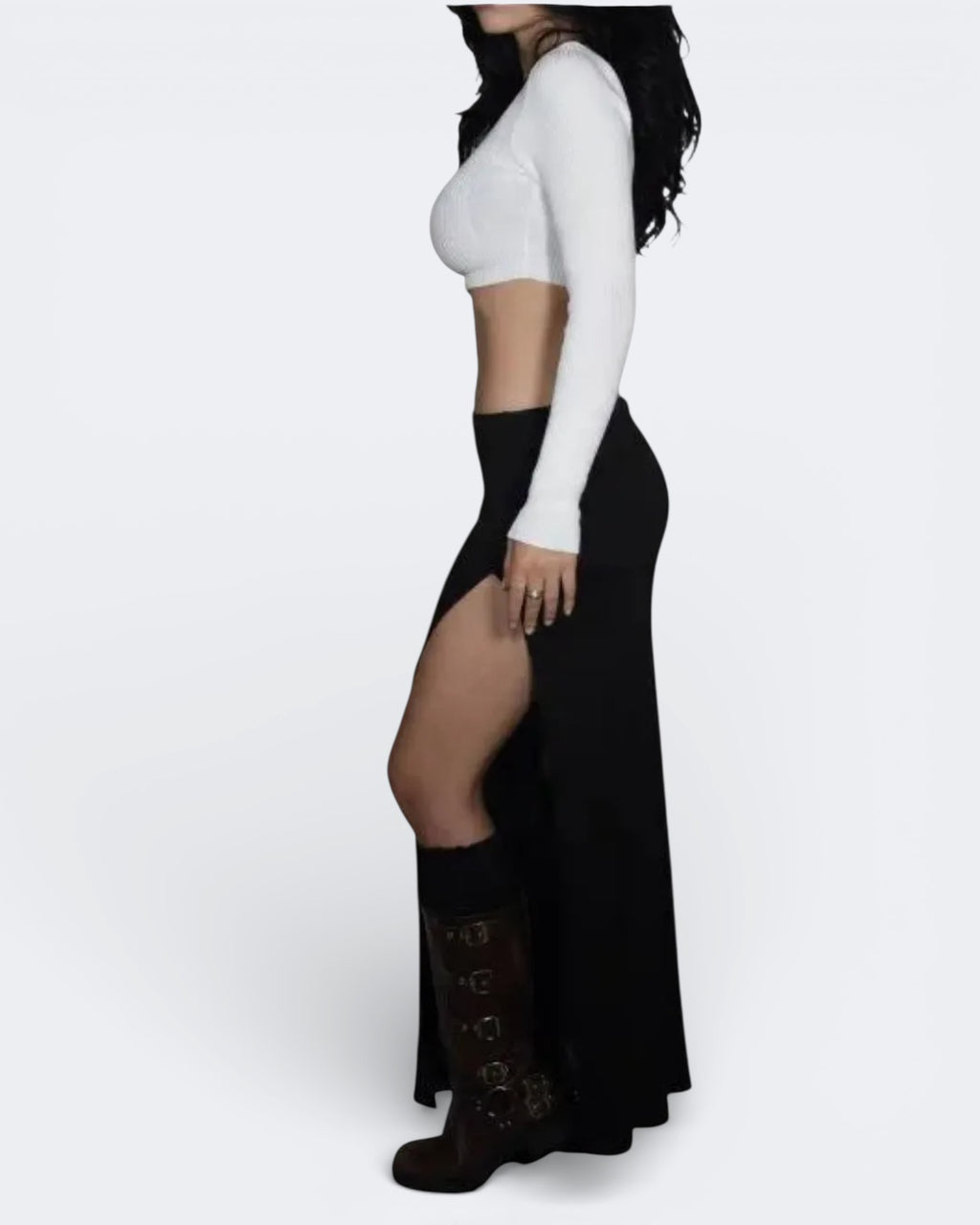Person wearing a rib knit Ink black long maxi high-slit skirt with a white top by The Knit House LA.