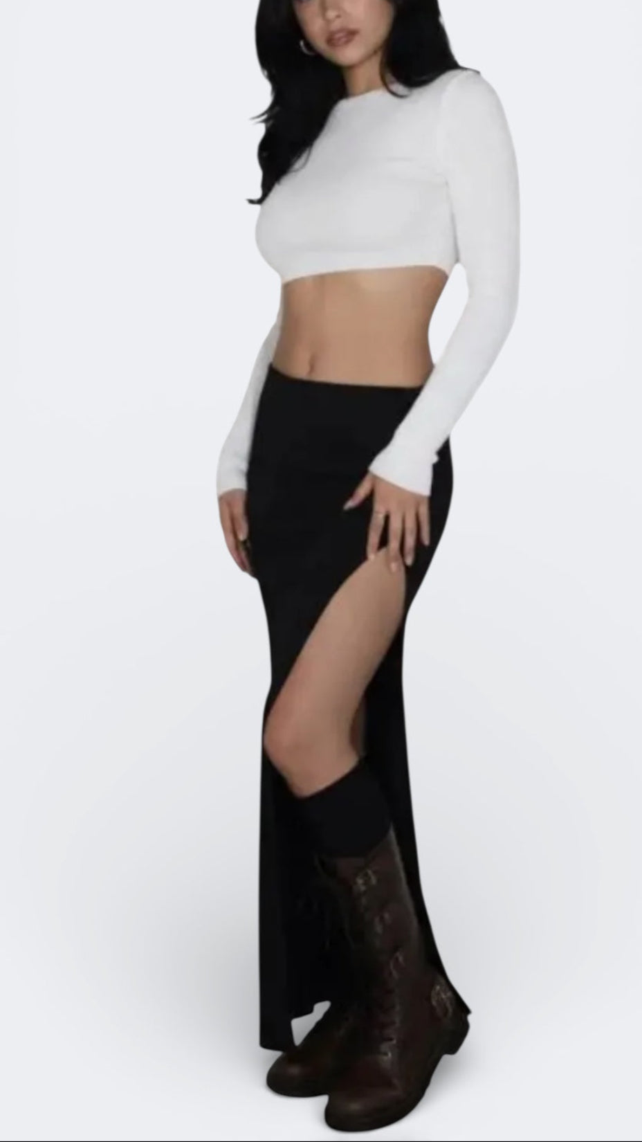Woman wearing rib knit long maxi skirt with front slit in Ink black by The Knit House LA.
