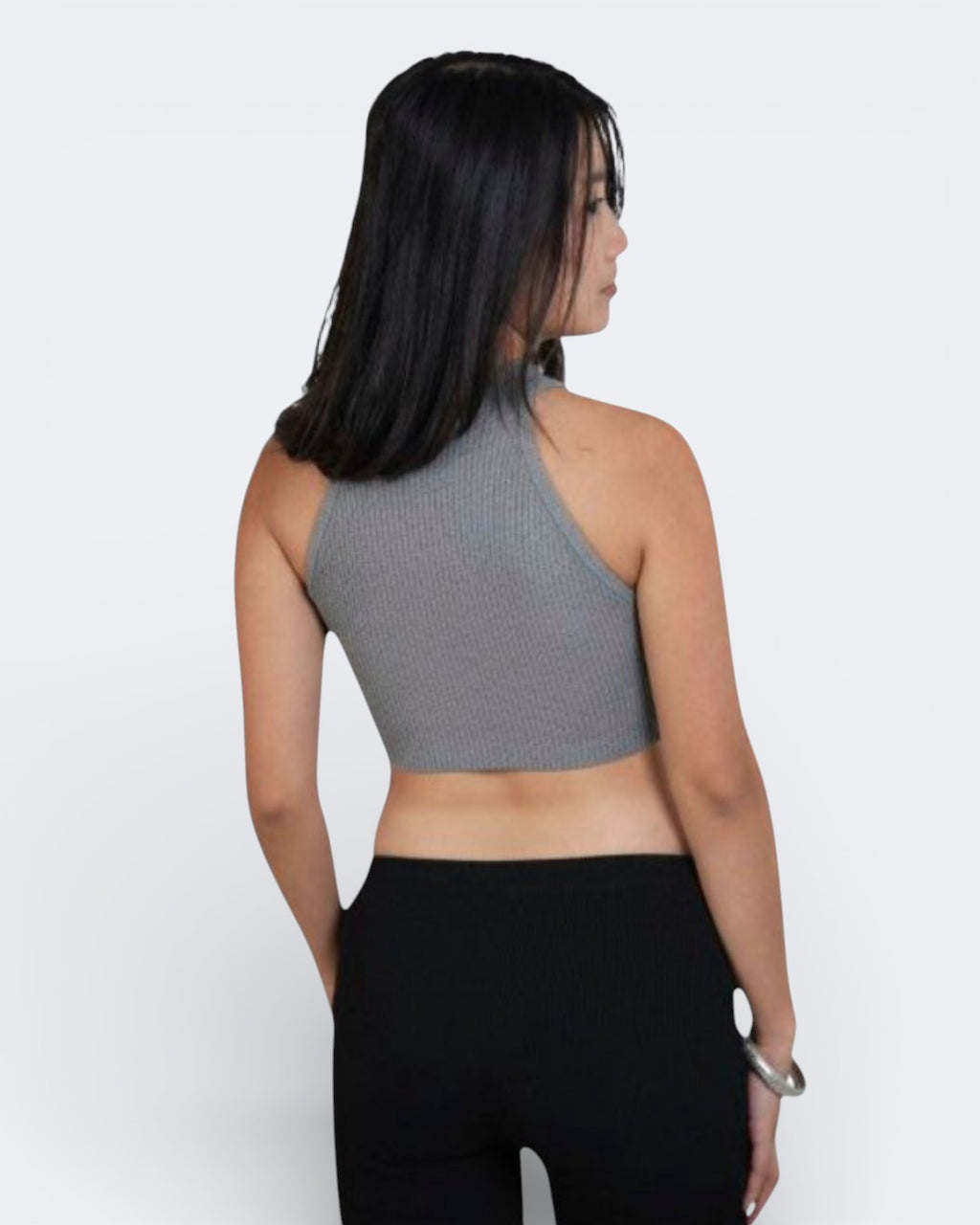 woman wearing a sleeveless fitted rib crop shell with high neck in Mist grey by The Knit House La.