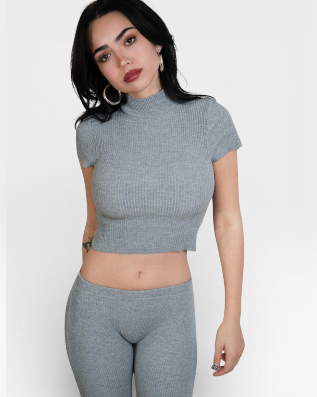 Woman wearing fitted rib crop top with short sleeves and high neck in Mist grey by The Knit House LA.