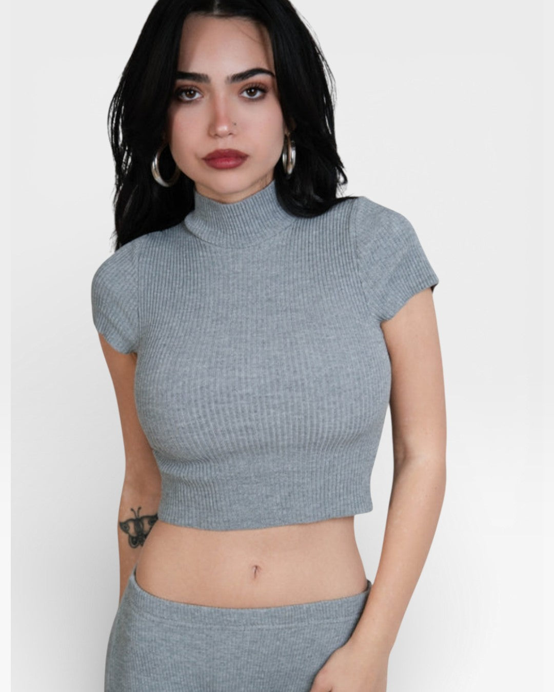Woman wearing fitted rib crop top with short sleeves and high neck in Mist grey by The Knit House LA.