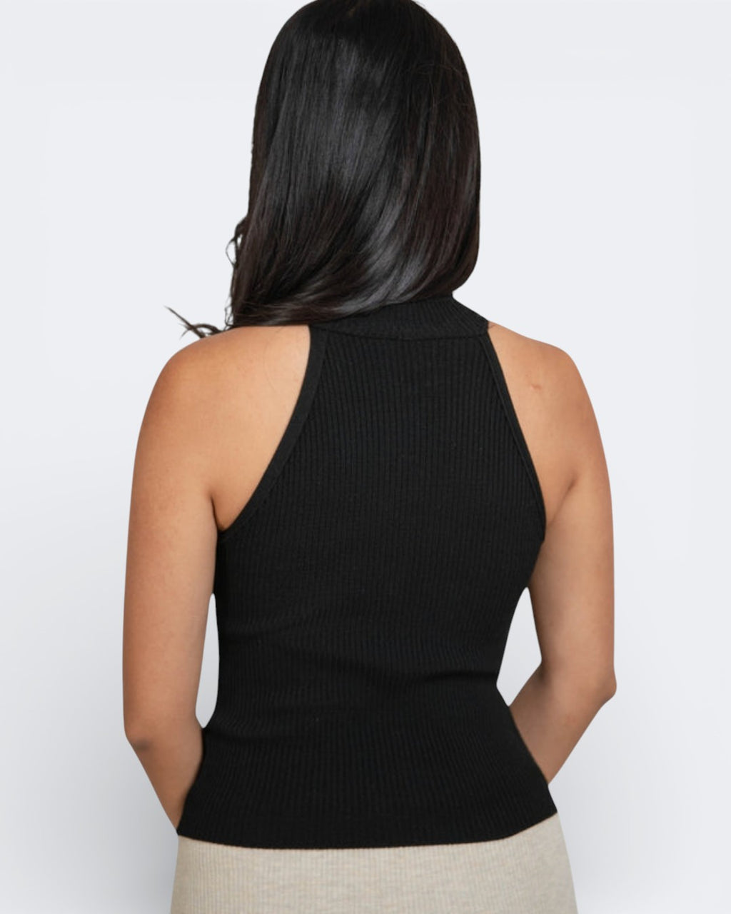 Back view of a fitted rib knit high neck sleeveless shell in Ink black by The Knit House LA.