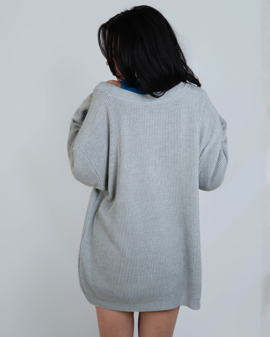woman wearing rib knit relaxed oversized cardigan in Mist grey by The Knit House LA.