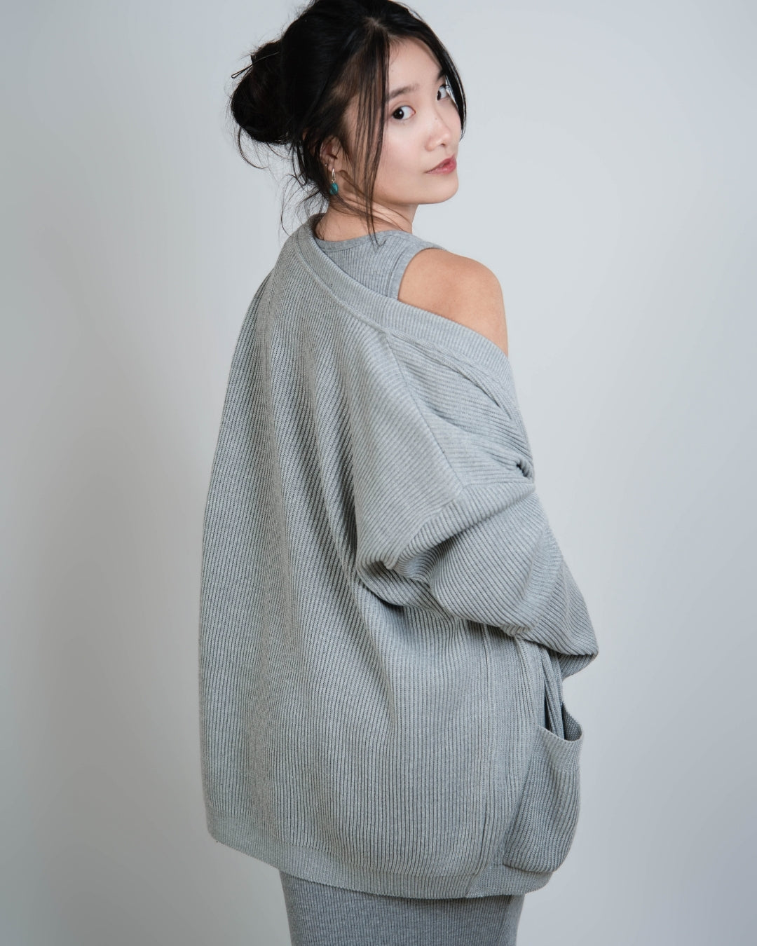 woman wearing rib knit relaxed oversized cardigan in Mist grey by The Knit House LA.