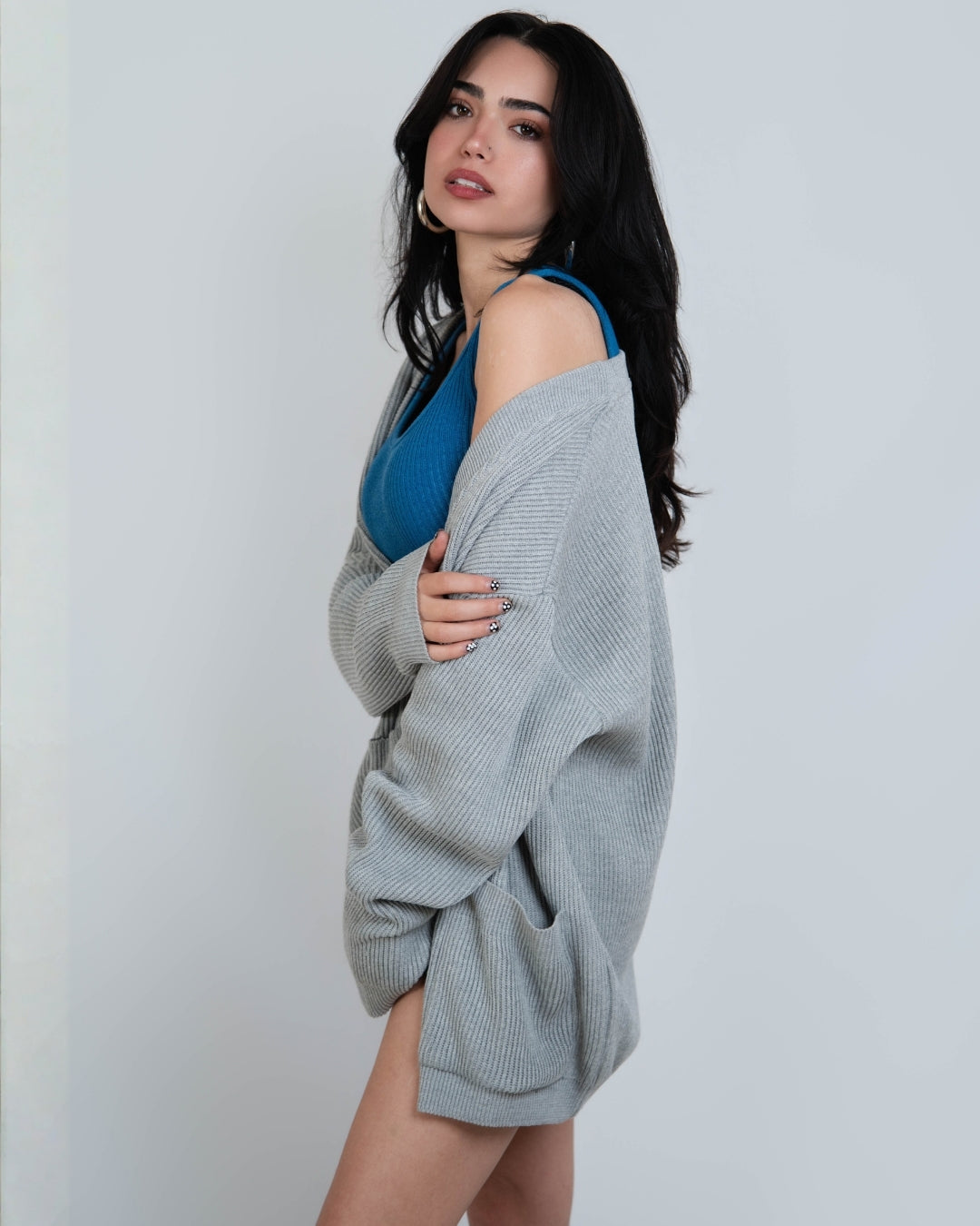 woman wearing rib knit relaxed oversized cardigan in Mist grey by The Knit House LA.