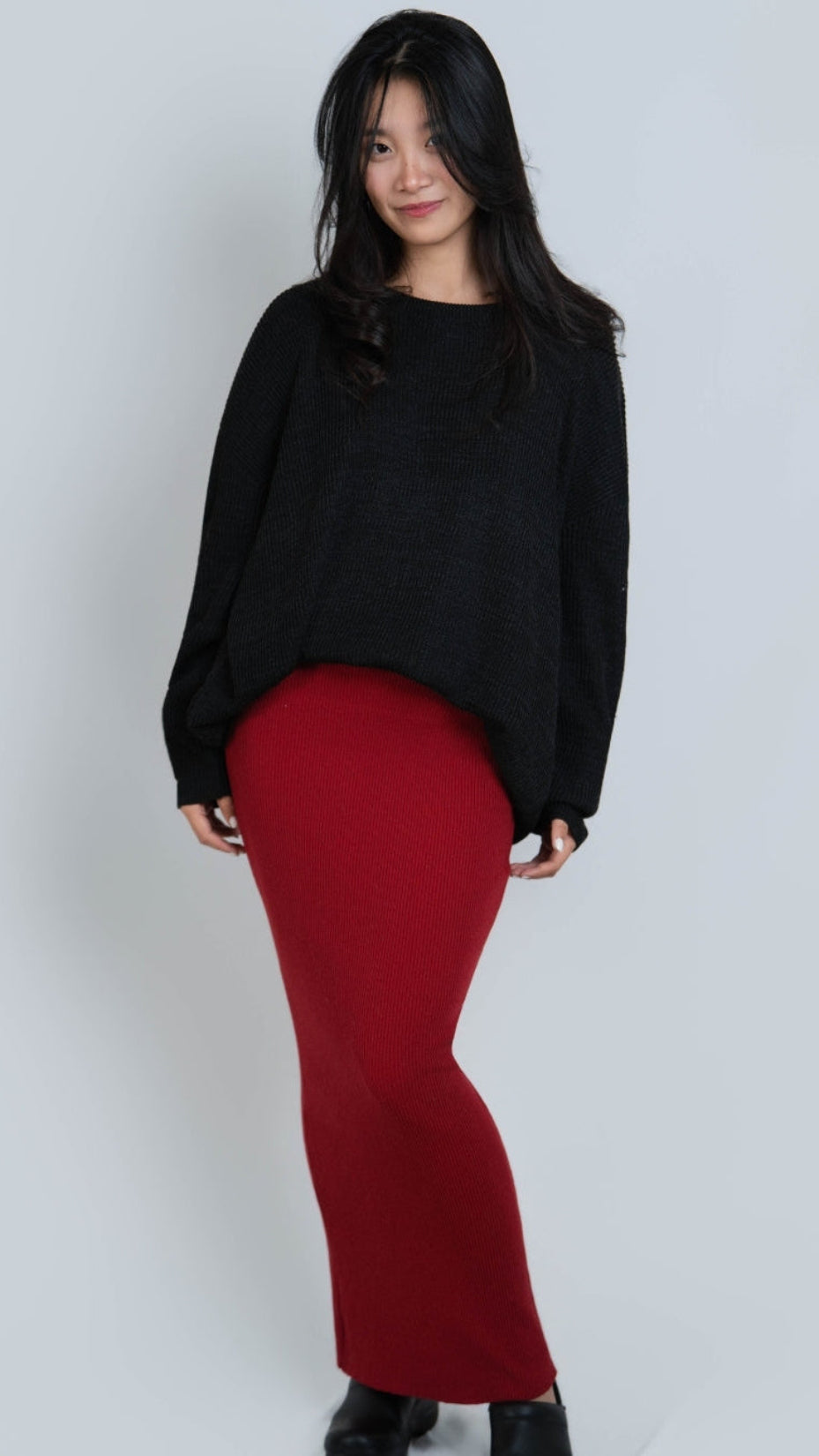 woman wearing an oversized crew neck sweater in Coal black by The Knit House LA.