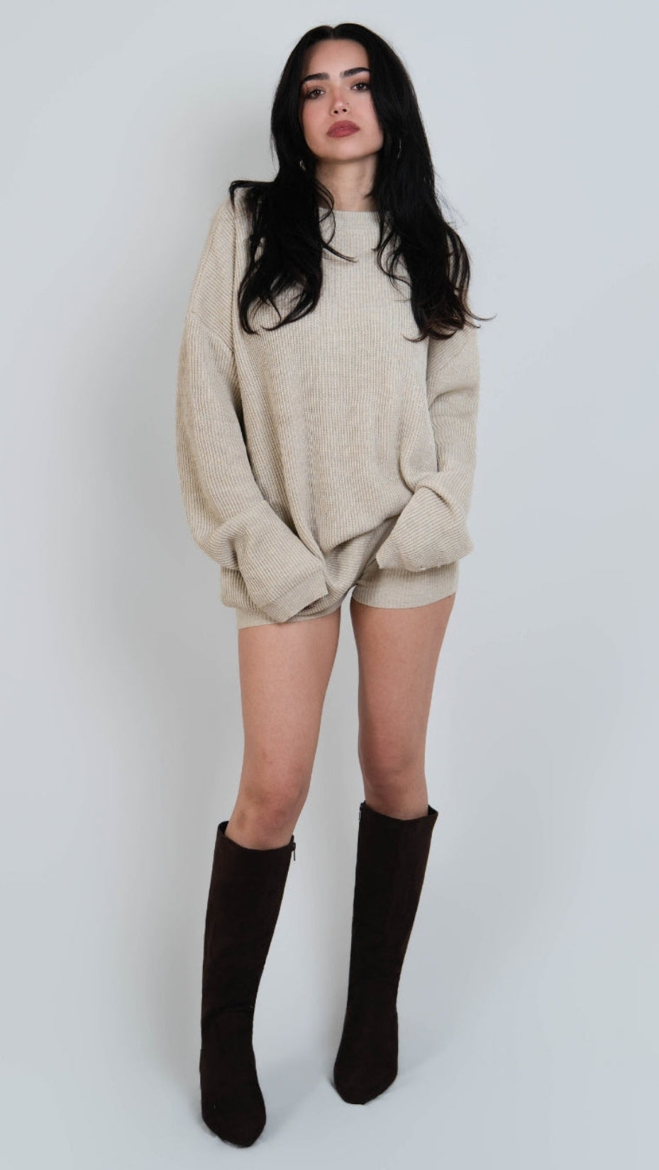 woman wearing rib knit oversized crew neck sweater in Neutral beige by The Knit House LA.