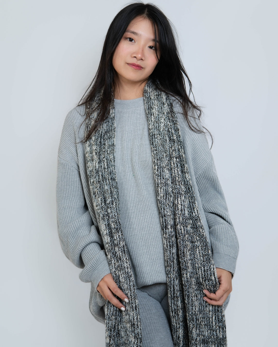 Woman wearing rib knit oversized crew neck sweater in Slate grey by The Knit House LA.