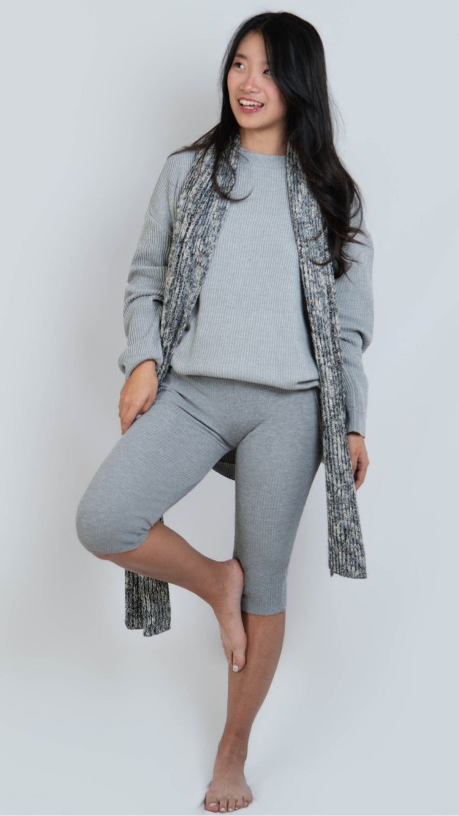 Woman wearing rib knit oversized crew neck sweater in Slate grey by The Knit House LA.