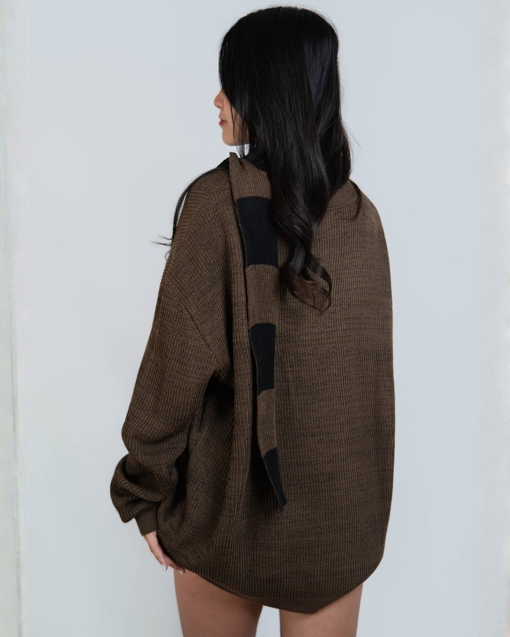 woman wearing rib knit long sleeve oversized crew neck sweater in Bark brown by The Knit House LA.