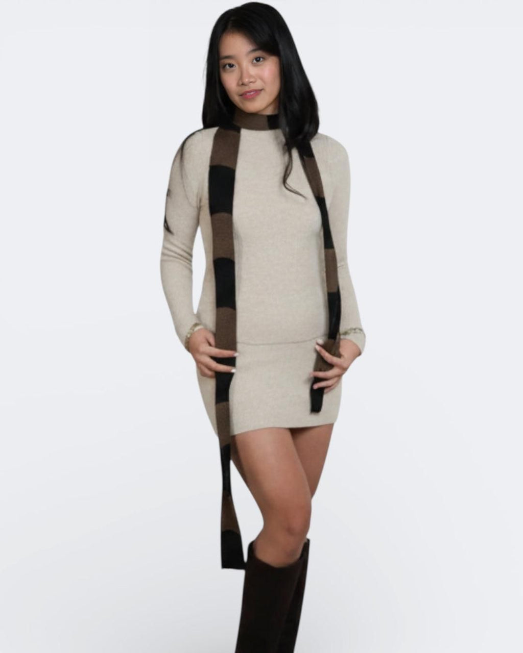 Woman wearing extra long skinny knit scarf in Bark brown and Coal black by The Knit House LA.