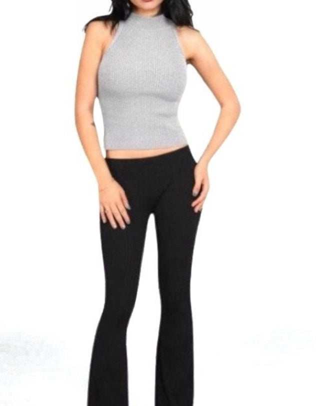 Woman wearing a fitted ribbed knit sleeveless shell with a high neck in Mist grey by The Knit House LA.